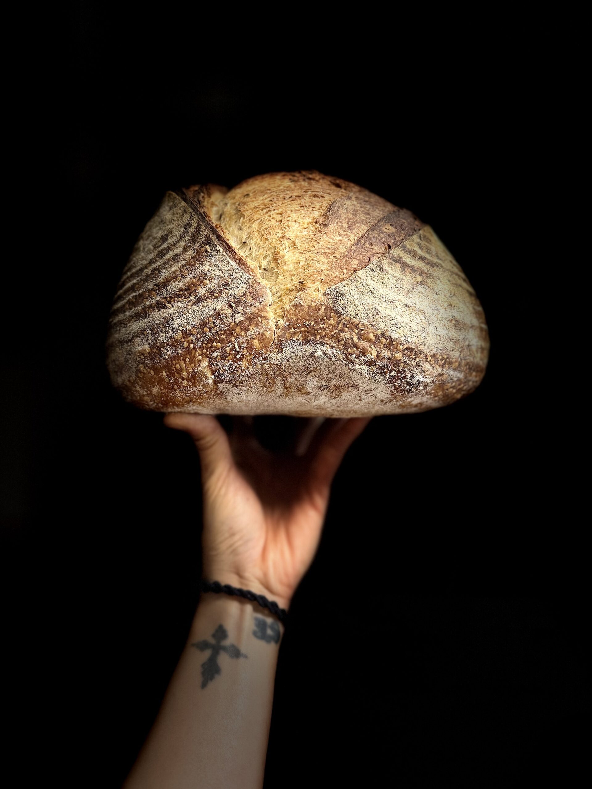 Anh holding up her sourdough
